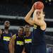Michigan players watch as freshman Mitch McGary lines up a free throw during a shooting contest at Cowboys Stadium in Arlington, Texas on Thursday, March 28, 2013. Melanie Maxwell I AnnArbor.com